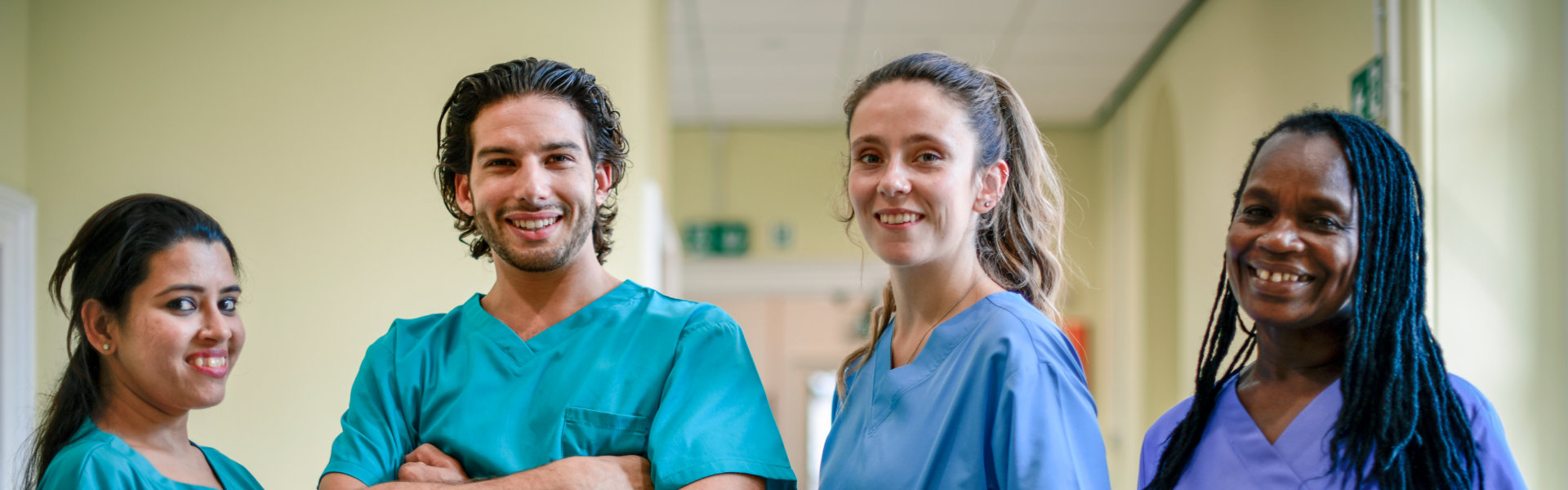 four caregivers smiling